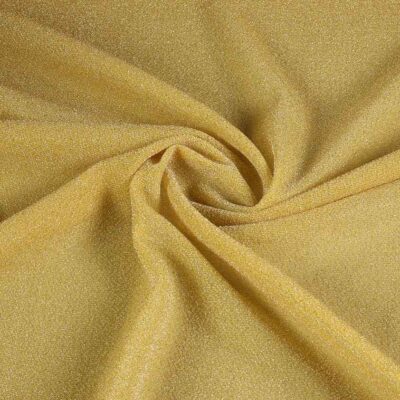 Tricot stof lurex okergeel