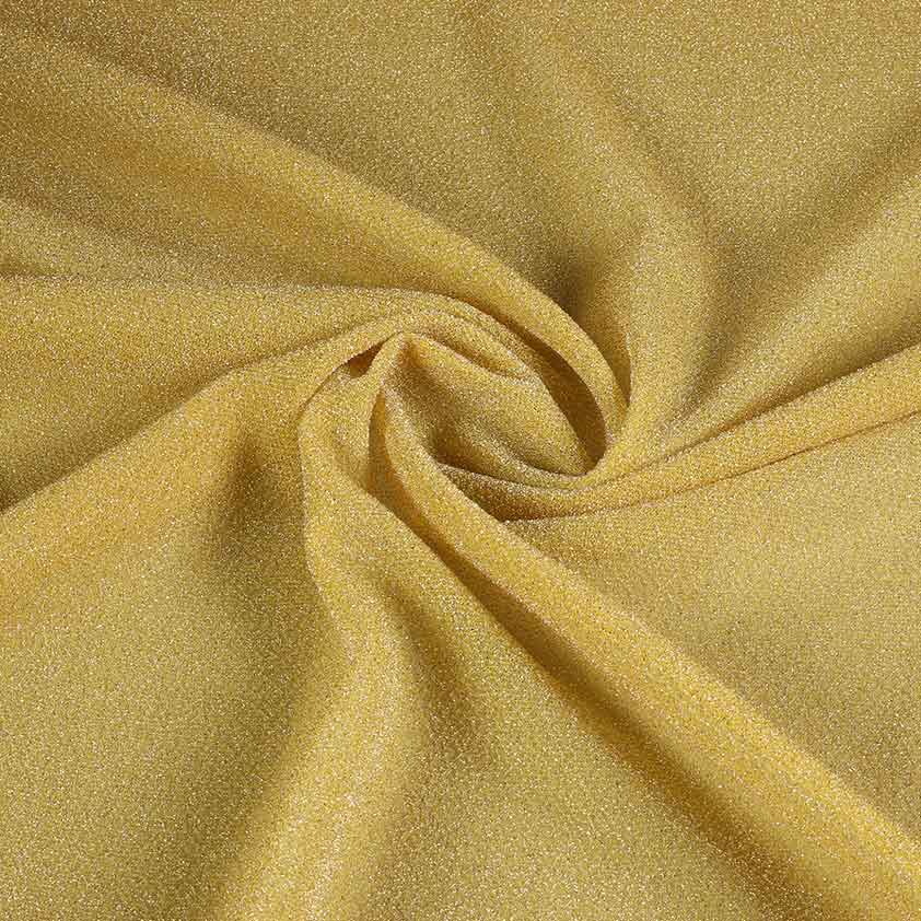 Tricot stof lurex okergeel