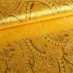Jacquard fantasie bloem okergeel goud